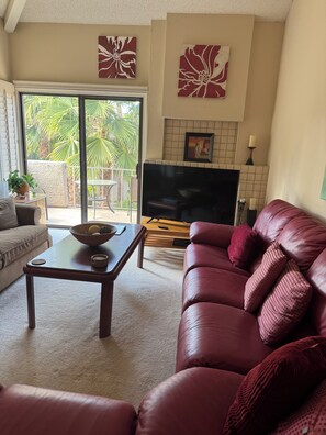 Gorgeous view out to the patio and balcony, complete with electric grill.