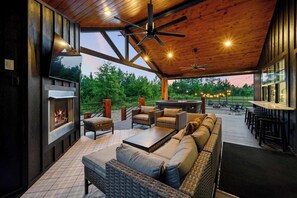 Step onto the expansive private deck, designed for ultimate relaxation and connection. Whether you're unwinding in the hot tub, gathered around the gas fireplace, or enjoying a movie on the Smart TV, this secluded retreat ensures uninterrupted comfort. Fire up the hard-lined propane grill for an al fresco feast, with plenty of seating for friends and family to kick back and enj...