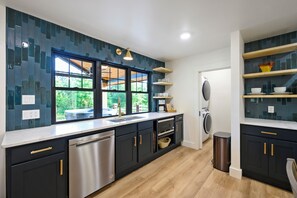 The kitchen is fully stocked, giving you everything you need to prepare your favorite meals with ease. Whether you're cooking a quick breakfast or a full-course dinner, you'll find all the essentials ready for you.

For added convenience, the guest laundry room is equipped with baby-friendly essentials, including a pack 'n play, booster highchair, and baby gate—making your stay...
