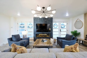 Enjoy our custom furnishings by Norwalk of OKC! Cozy up to the 60” electric fireplace with multiple lighting features plus heat!