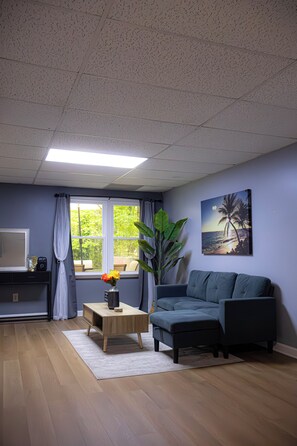 A bright, modern space, stylishly decorated, with a comfortable sectional sofa