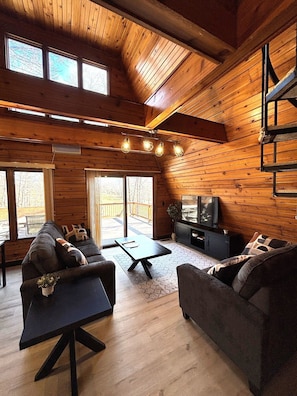 Main level living area, patio door to deck