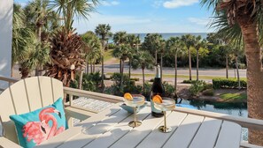 Enjoy your favorite cocktails on the balcony as you gaze upon the emerald waters