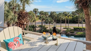 Enjoy your favorite cocktails on the balcony as you gaze upon the emerald waters