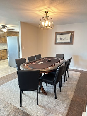 Poker room, equipped with cards, chips and dice
