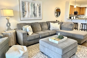 The living room is equipped with sleeper sofa, love seat, and chair.