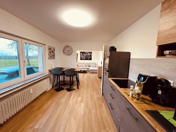 Spacious living and dining area in a modern style. (1)