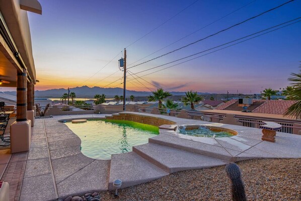 Unwind in your private oasis with a serene pool and spa.