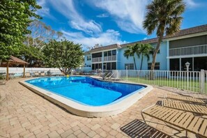 The lanai overlooks the heated pool and shuffle board court. 