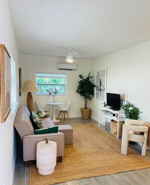 Stylish living room with dining nook and convertible sofa