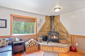 Cozy living area with leather sofa and decorative fireplace