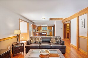 Cozy living area with leather sofa and decorative fireplace