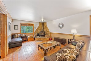 Cozy living area with leather sofa and decorative fireplace