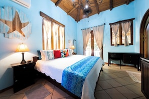 Wake up to coastal charm in this principal bedroom with king-bed & private bath.