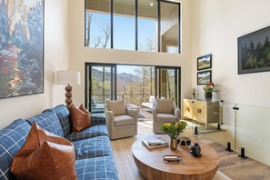 Upper living room extends to the fire table seating area