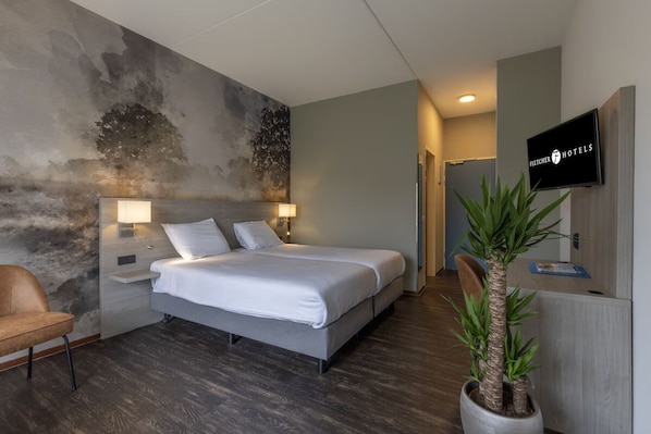 Unit with 2 single beds. Exact unit will be assigned upon arrival. Views, colors, and decor may vary.