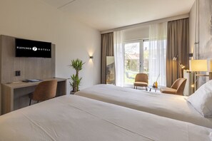 Unit with 2 single beds. Exact unit will be assigned upon arrival. Views, colors, and decor may vary.