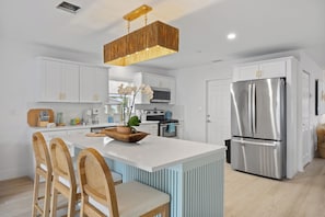 Full size kitchen with all necessary appliances and accessories.