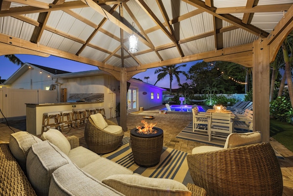 Gazebo w/ comfortable furniture and fire pit