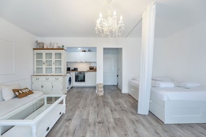 A glimpse across the open-plan layout – highlighting the blend of modern amenities with cozy vintage touches.