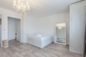 A harmonious blend of living, cooking, and sleeping areas with charming decor and practical furnishings.