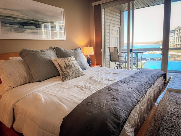 This comfortable king suite features direct access to your private lakefront deck, allowing you to enjoy breathtaking lake and marina views from the moment you rise.