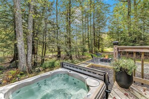 Relax in the outdoor hot tub while enjoying breathtaking scenic views — the perfect spot to unwind and soak in nature!