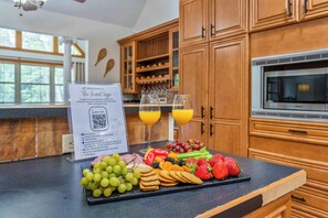 Whip up family feasts or casual brunch in this fully equipped kitchen featuring double ovens, modern appliances, and loads of prep space. Perfect for large groups or holiday meals.
