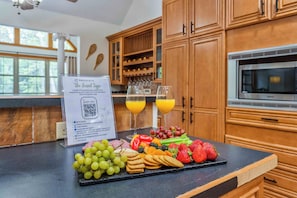 Whip up family feasts or casual brunch in this fully equipped kitchen featuring double ovens, modern appliances, and loads of prep space. Perfect for large groups or holiday meals.