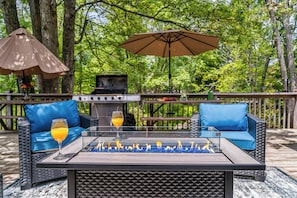 Fire up the BBQ and enjoy an al fresco feast at this serene picnic spot, surrounded by lush greenery and the sounds of nature. With a spacious grill, shaded umbrella, and rustic dining bench, it's the perfect setting for family cookouts, sunset snacks, or a laid-back lunch in the woods.