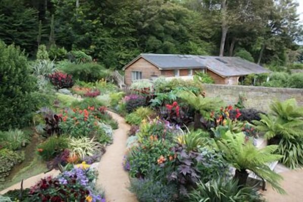 Welcome to your woodland escape — tucked away within a peaceful Victorian garden and just moments from the coast.