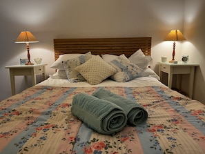 A cosy double bedroom with garden views and its own private ensuite — perfect for slow mornings and early nights.