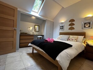 Charming Bedroom: Unwind in style with plush bedding and delightful decorative touches!