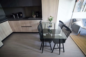 Modern kitchen with sleek design, perfect for preparing meals and enjoying dining moments in style.