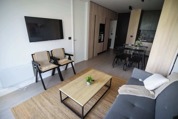 Stylish and modern living space with a cozy vibe, perfect for relaxing after a day of exploring.