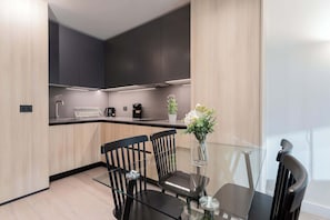 Experience modern elegance in this fully equipped kitchen, perfect for culinary adventures and cozy dining moments.
