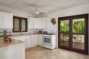 The large, open plan kitchen is equipped with everything you need, including an outdoor gas barbecue, making it easy to prepare and cook your favourite meals. The veranda is conveniently accessed from the front door