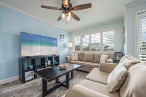Curl up in the coastal living room & stream your favorites on the smart TV