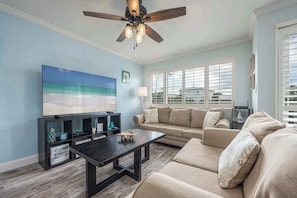 Curl up in the coastal living room & stream your favorites on the smart TV