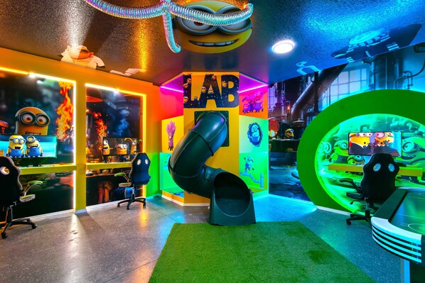 Epic Minion-Themed Game Room with Slide, Neon Lights & Fun for All Ages
