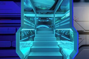 Futuristic Space Pod Bedroom with Bunk Beds, LED Glow, and Sci-Fi Vibes
