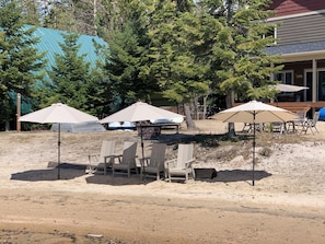 Beach with umbrellas for your use.