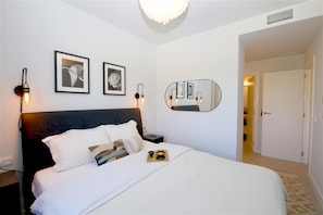 Master bedroom from a different angle with en-suite bathroom to the rear