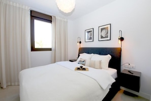 Master bedroom with king-size bed and en-suite bathroom