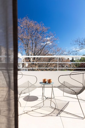 Private terrace with outdoor seating, ideal for shared meals, morning coffees, or quiet evening moments.