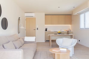 Spacious open-plan layout connecting the lounge and kitchen—perfect for socializing or relaxing after a day out.