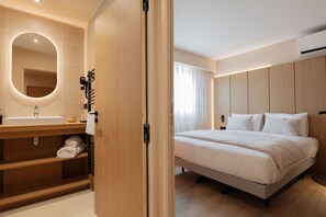 Bright and comfortable bedroom with warm wood accents and soft lighting—designed for restful nights.