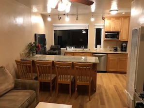 Portion of living room. Has newer sleeper sofa not pictured & TV on right wall.