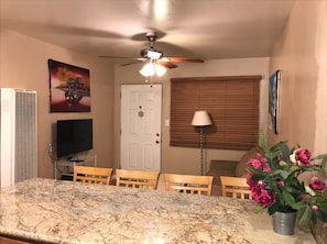 Big dining bar permits viewing ocean or living room. Granite countertops.
