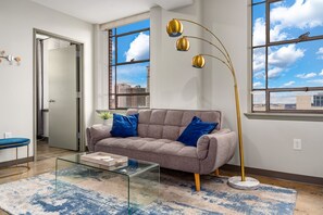 Chic living area with contemporary decor and large windows offering stunning views.